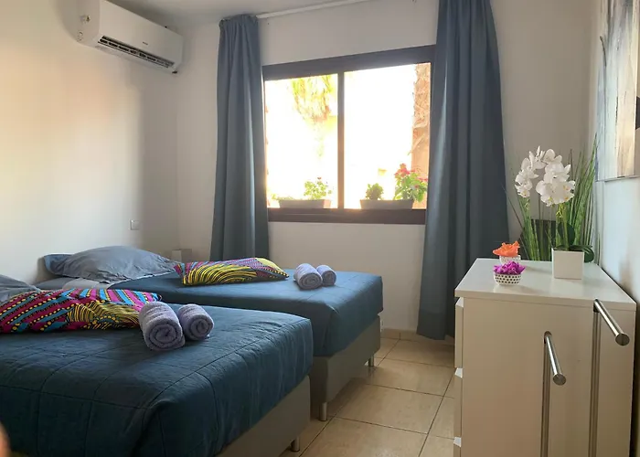 Bedroom With Shared Bathroom And Swimming Pool